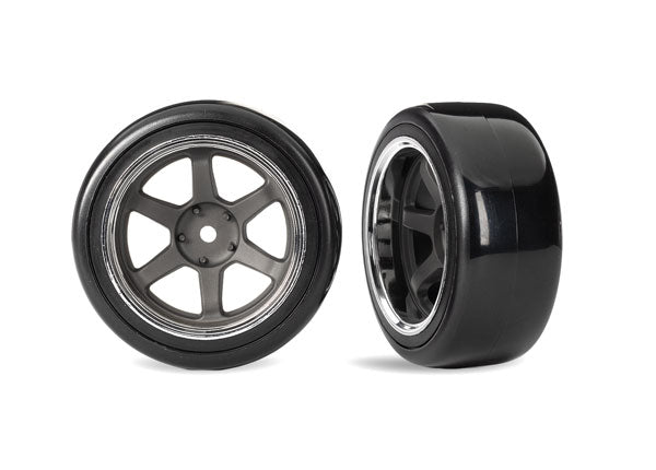 Traxxas 10575 Tires & Wheels, assembled, glued (six spoke graphite - Gray Wheels w/chrome rim, 1.9" Drift Tires (1 dot, hard, rough surfaces)) (wide, Rear) (2)