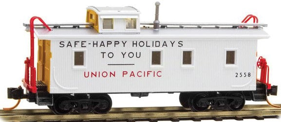 Micro-Trains 34' Wood-Sheathed Caboose w/Slanted Cupola - Ready to Run -- Union Pacific #2558 (1954 Holiday Scheme, white, yellow, Safe-Happy Holidays - 489-5000170
