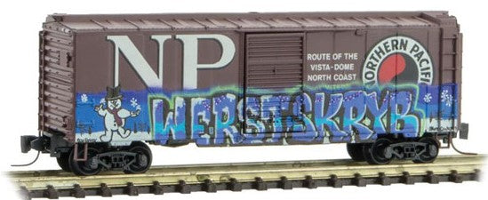 Micro-Trains 40' Single-Door Boxcar - Ready to Run -- Northern Pacific (Weathered, Boxcar Red, Christmas Graffiti) - 489-50044870