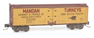 Micro-Trains 40' Wood Reefer - Ready to Run -- Mandan Creamery & Produce MCPX #2000 (yellow, Boxcar Red) - 489-51800050