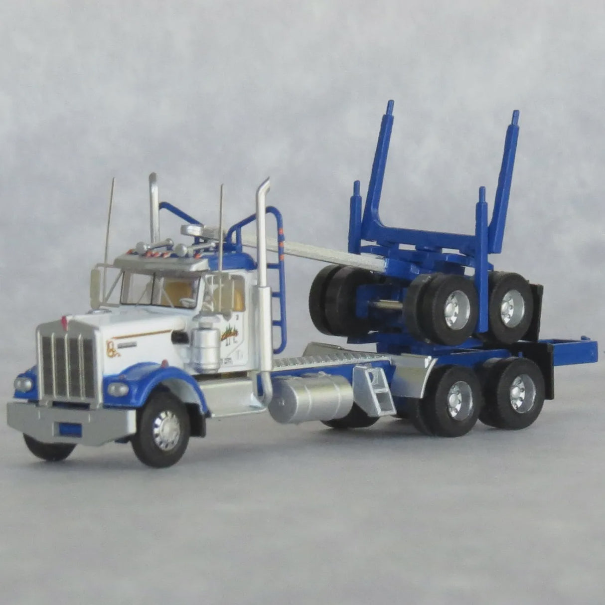 Trainworx N 3-Axle Log Truck with Trailer - Assembled -- Gene Whittaker #2 (Dark Blue, white)