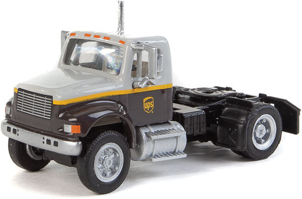 Walthers SceneMaster International(R) 4900 Single-Axle Semi Tractor Only - Assembled -- UPS Freight(SM) (gray, gold, brown) - 949-11194